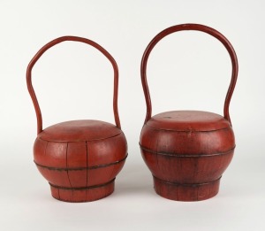 A pair of Chinese red lacquered rice carriers, 20th century, 43cm high
