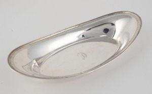 An antique sterling silver oval bread tray, most likely American, circa 1900, stamped "STERLING", ​​​​​​​28.5cm wide, 220 grams