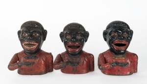 Three assorted antique American cast iron money banks, all with red painted finishes, 19th/20th, ​​​​​​​the largest 17cm high