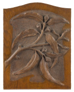 An Australian carved timber panel with gumnuts and leaves, early 20th most likely originally a panel from a wardrobe or sideboard back, 39 x 30cm