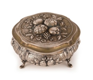 An antique German silver box with repousse fruit decoration and cabriole legs, remains of gilt wash finish still showing, 19th century, crown and crescent mark, stamped 800, 5.5cm high, 11.5cm wide, 270 grams