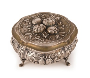 An antique German silver box with repousse fruit decoration and cabriole legs, remains of gilt wash finish still showing, 19th century, crown and crescent mark, stamped 800, 5.5cm high, 11.5cm wide, 270 grams