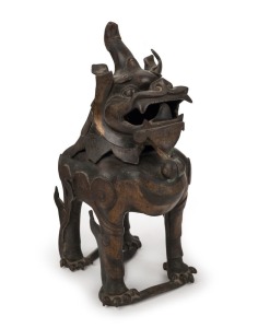 An antique Chinese bronze Foo dog censer with remains of gilt decoration, 18th century, ​​​​​​​31cm high