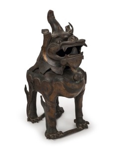 An antique Chinese bronze Foo dog censer with remains of gilt decoration, 18th century, 31cm high