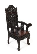 An ornate Chinese carved hardwood armchair with dragon motif, early to mid 20th century, 119cm high, 52cm across the arms