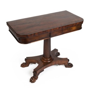 A William IV swivel top fold-over card table, veneered in Brazilian rosewood with tapered pedestal, quad-form base, and lions paw feet with steel castors, circa 1840, 75cm high, 92cm wide, 45cm deep, 92cm deep when open.