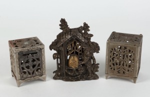 Three antique American cast iron money banks, 19th/20th century, ​​​​​​​the largest 14cm high