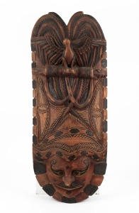 A tribal mask, carved wood with remains of colour decoration, Papua New Guinea, ​​​​​​​85cm high