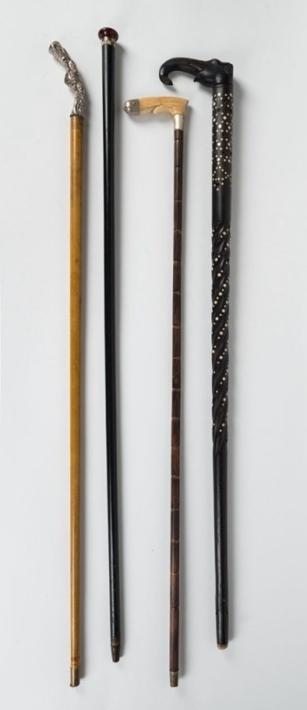 Four antique walking sticks, 19th/20th century, the largest 93cm high