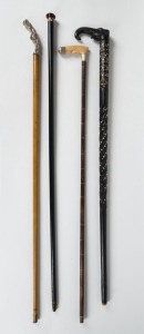 Four antique walking sticks, 19th/20th century, the largest 93cm high