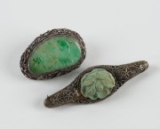 Two Chinese silver and jade brooches, early to mid 20th century, 5.5cm and 3.5cm wide