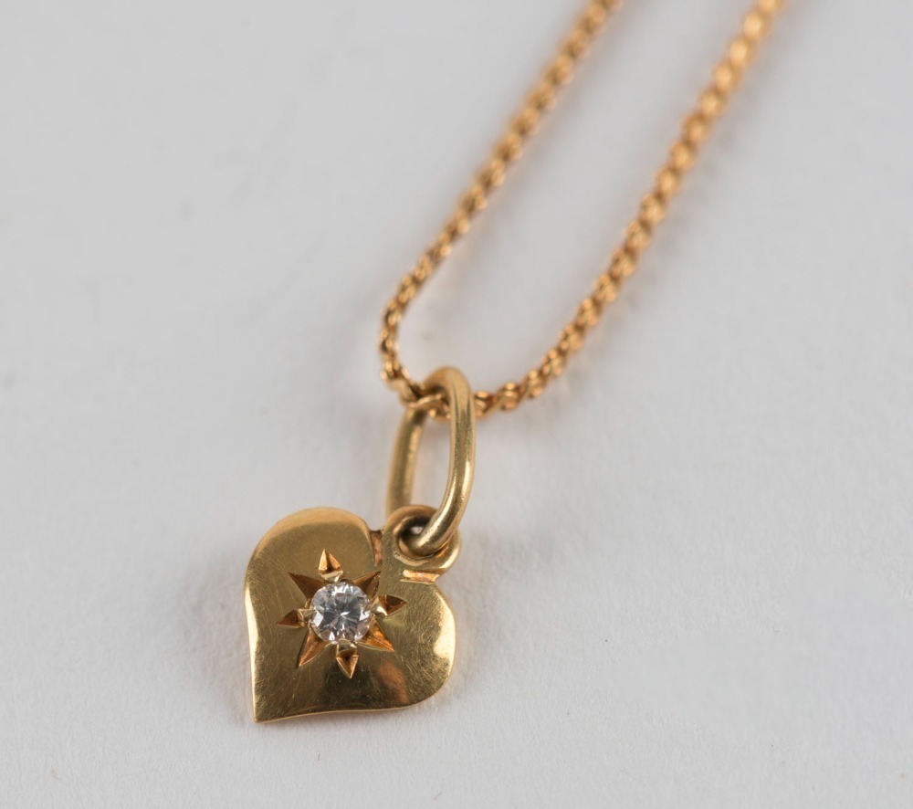 An Italian 18ct gold necklace with a diamond set heart pendant, late ...