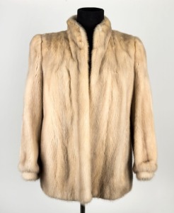 A lady's snow fur jacket with sage green satin lining