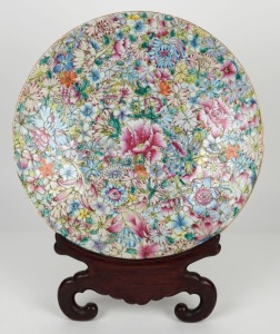 An antique Chinese Canton porcelain charger (A/F) on carved wooden stand, 19th century, 41cm diameter