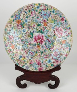 An antique Chinese Canton porcelain charger (A/F) on carved wooden stand, 19th century,  ​​​​​​​41cm diameter