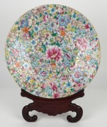 An antique Chinese Canton porcelain charger (A/F) on carved wooden stand, 19th century,&nbsp; ​​​​​​​41cm diameter