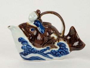 HIRADO WARE Japanese sake ewer in the form of a man and fish, 15cm high, 23cm long