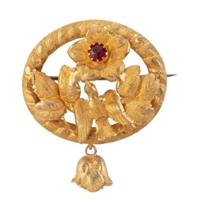 A Colonial Australian 18ct yellow gold oval brooch adorned with bird, leaves and flower set with red stone, 19th century, 4cm wide, 4.2 grams