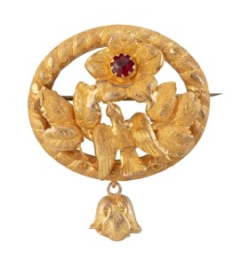 A Colonial Australian 18ct yellow gold oval brooch adorned with bird, leaves and flower set with red stone, 19th century, 4cm wide, 4.2 grams