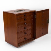 An antique English mahogany collector's travel cabinet fitted with six drawers and brass swing carry handle, 19th century, ​​​​​​​37cm high, 31cm wide, 24cm deep