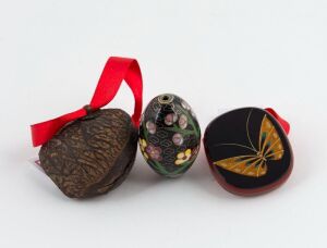 An antique Japanese carved tagua nut netsuke (Edo period), a Japanese obi dome (20th century), together with a cloisonne egg, (3 items), the egg 4cm high