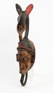 A ceremonial elephant mask, carved wood with painted finish, Guro tribe, Ivory Coast, West Africa, 74cm high 