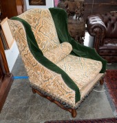 A pair of antique French wingback armchairs, 19th century, 99cm high, 80cm across the arms, 92cm deep