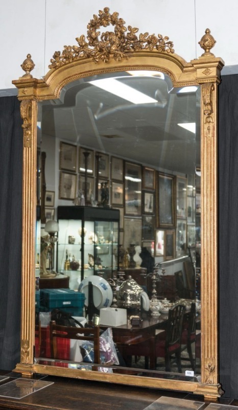 An antique French ornate gilt framed mirror, 19th century, (glass replaced), 187cm high, 115cm wide