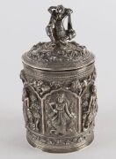 A fine Burmese silver box with repousse decoration and figural finial. 19th/20th century. Note the inclusion of winged angel and lion decoration. 15cm high, 334 grams - 2