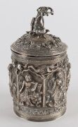 A fine Burmese silver box with repousse decoration and figural finial. 19th/20th century. Note the inclusion of winged angel and lion decoration. 15cm high, 334 grams - 3