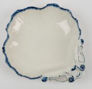 Four assorted porcelain bowls and a pottery boar's head ornament, (5 items), the largest bowl 25cm diameter - 9