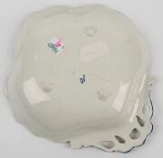 Four assorted porcelain bowls and a pottery boar's head ornament, (5 items), the largest bowl 25cm diameter - 10