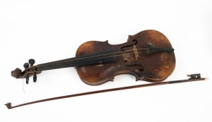 Antique Continental violin, most likely German or Bohemian, stamped on reverse "Stainer", bearing label "Copy of Jacobus Stainer", 19th century. Together with a period coffin case and bow. 59cm long