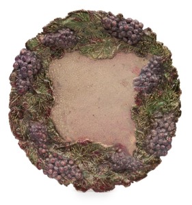 UNA DEERBON, impressive pottery platter with applied grapes and leaves, incised "Una Deerbon", 38.5cm wide