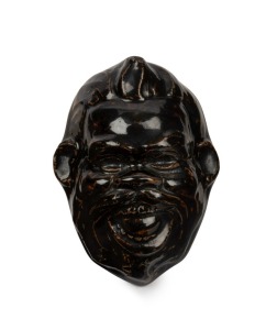 ARTIST UNKNOWN "Mulga Fred" (also known as "Pelaco Bill"), glazed ceramic head, engraved verso "Pelaco" and other words which are not legible. [The only example known to us.] ​​​​​​​11 x 8.5cm,