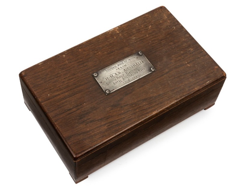 H.M.A.S. AUSTRALIA antique cigar box bearing a silver label "SOUVENIR MADE FROM WOOD FROM H.M.A.S. AUSTRALIA, FIRST FLAGSHIP, ROYAL AUSTRALIAN NAVY,1913-1920", 8.5cm high, 25.5cm wide, 16cm deep