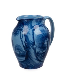 DAISY MERTON blue pottery jug with painted landscape scene, stamped "NEWTONE POTTERY, SYDNEY, HAND PAINTED", 16.5cm high