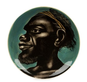 MARTIN BOYD pottery plaque with an Aboriginal male portrait on blue ground, incised "Martin Boyd, Australia", ​​​​​​​26cm diameter