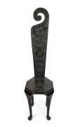 An antique spinner's chair with later WW2 period folk art chip carving displaying American and Australian flags, rising sun, propeller, wings and aeroplanes, ​​​​​​​125cm high