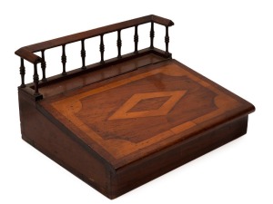 An antique Australian writing slope with unusual gallery top. Australian cedar casuarina (beefwood) and kauri pine. Interior fitted with compartments and drawers, 19th century, 23cm high, 41cm wide, 35 cm deep