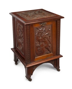 ROBERT PRENZEL (attributed), a fine Tasmanian blackwood coal scuttle of generous proportions, carved in the Gothic manner with winged Grotesque to the top and stylised Griffin with shield initials to the hinged fall front with original tin liner, chamfered legs with carved brackets and porcelain castors, circa 1905, 78cm high, 51cm wide, 51cm deep