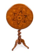 ANTON SEUFFERT (1815-1887) New Zealand, fine and rare tilt-top wine table with mottled Kauri tapering barley twist stem and three scroll legs, radiating starburst marquetry top with lozenge parquetry ground, inlaid with numerous native timbers, circa 1870 - 2