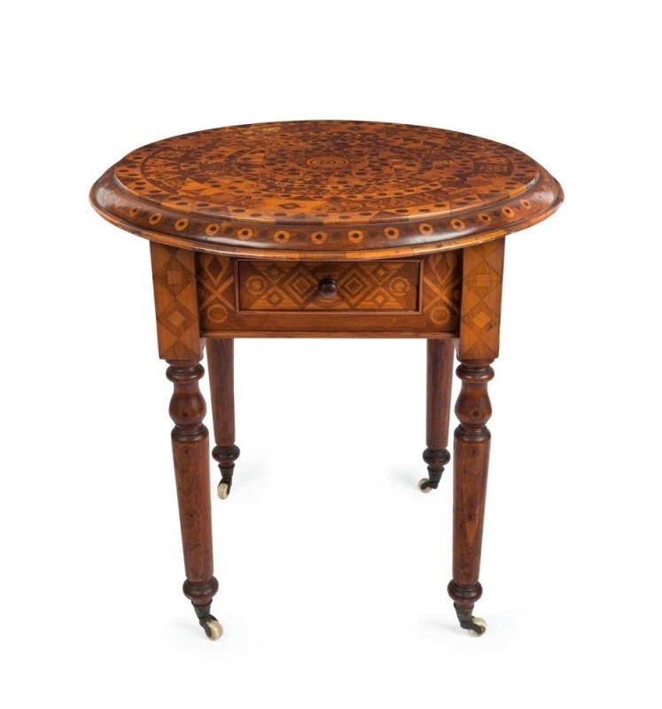 An unusual antique Australian circular table, profusely inlaid on all surfaces in Australian specimen timbers, the drawer attractively fitted for gaming, 19th century, ​​​​​​​79cm high, 77cm diameter