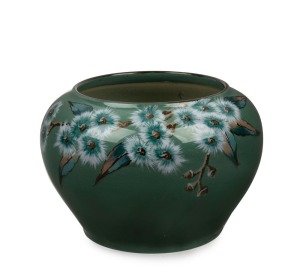 DAISY MERTON hand-painted green glazed pottery vase with gum blossoms, stamped "NEWTONE POTTERY, SYDNEY, Hand Painted", ​​​​​​​11.5cm high, 16cm wide