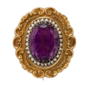 An impressive antique 18ct gold oval shaped brooch set with a large amethyst, surrounded by seed pearls, circa 1850, 5cm wide, 28.9 grams total