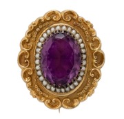 An impressive antique 18ct gold oval shaped brooch set with a large amethyst, surrounded by seed pearls, circa 1850, ​​​​​​​5cm wide, 28.9 grams total