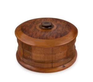 A circular New Zealand specimen timber box, 20th century, 10cm high, 18cm diameter