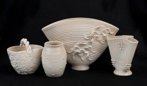 JANET GRAY group of four Australian pottery vases with cream glazes, incised "Janet Gray", the largest 17.5cm high