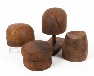 HAT BLOCKS: Group of four Australian huon and Baltic pine examples (one on stand), 19th/20th century, ​​​​​​​the largest 28cm high overall
