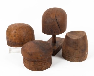 HAT BLOCKS: Group of four Australian huon and Baltic pine examples (one on stand), 19th/20th century, the largest 28cm high overall